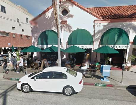 A white car parked in front of a restaurant

Description automatically generated with medium confidence