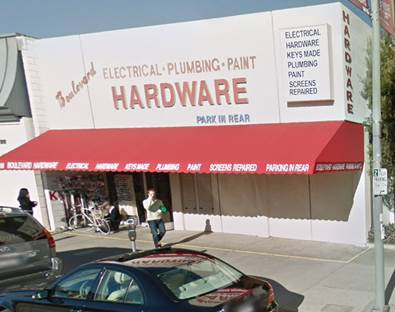 A store front with a red awning

Description automatically generated with low confidence